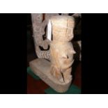 An old carved wooden canoe prow - woman figure, fr