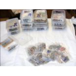 Twelve plastic tubs containing collectable stamps,
