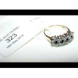 A 9ct gold sapphire and white stone ring