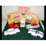 Four restored Dinky Toys, including Universal