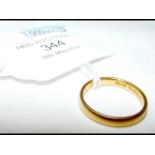 A 22ct gold wedding band - 3.2g