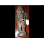 A carved wooden Ramu River ancestral figure - 26cm