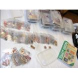Eleven plastic containers with collectable stamps