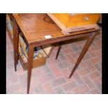 An inlaid antique occasional table