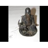 A small bronze deity figure