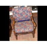 Decoratively carved antique armchair with turned s