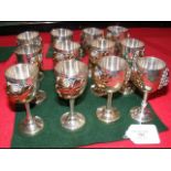 A set of twelve sterling silver liqueur glasses wi