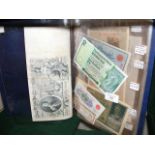 An interesting folder of early banknotes, includin