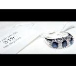 An 18ct white gold sapphire and diamond ring