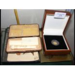 Small gold coin in presentation case, together wit