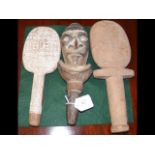 Three carved wooden dance paddles from the Trobria