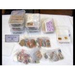 Seven plastic tubs with stamps relating to Spain,
