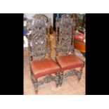 Pair of carved 19th century oak hall chairs