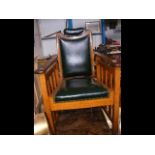 An adjustable antique oak framed Barber's chair