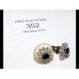 A pair of sapphire stud earrings