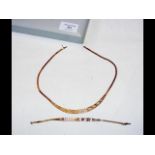 A lady's elegant 9ct gold necklace, together with
