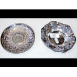 A silver dish with central coin mount, together wi