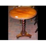 A 19th century wine table on barley twist support