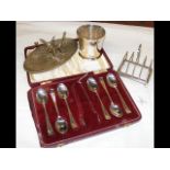 Silver toast rack, beaker, together with teaspoons, etc.