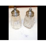 A silver top sugar shaker and one other