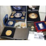 Various collectable coins in presentation cases, i