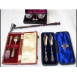 A silver cased knife and fork, table salts, etc.