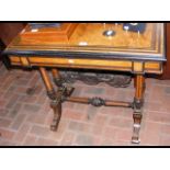 A 19th century walnut fold-over games table