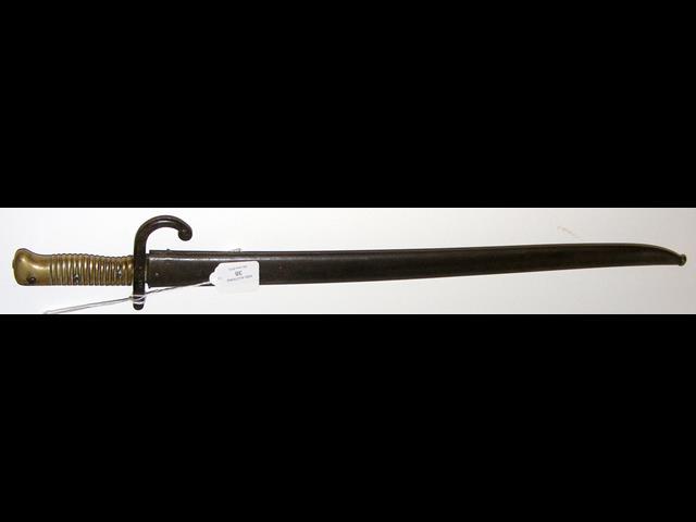 An old sword bayonet with metal scabbard