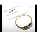 A three stone diamond ring in 18ct gold setting