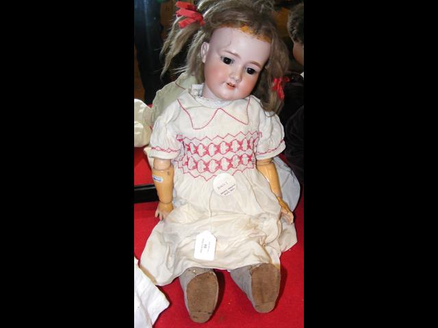 An antique Armand Marseille bisque head doll with