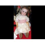 An antique Armand Marseille bisque head doll with