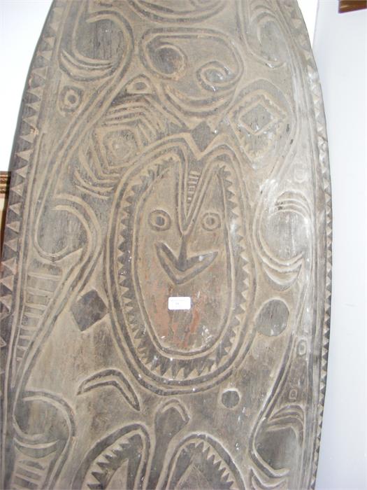 A large carved wooden war shield from the Sepik re - Image 2 of 4