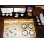 Various collectable coin sets, including "The 70th Ann