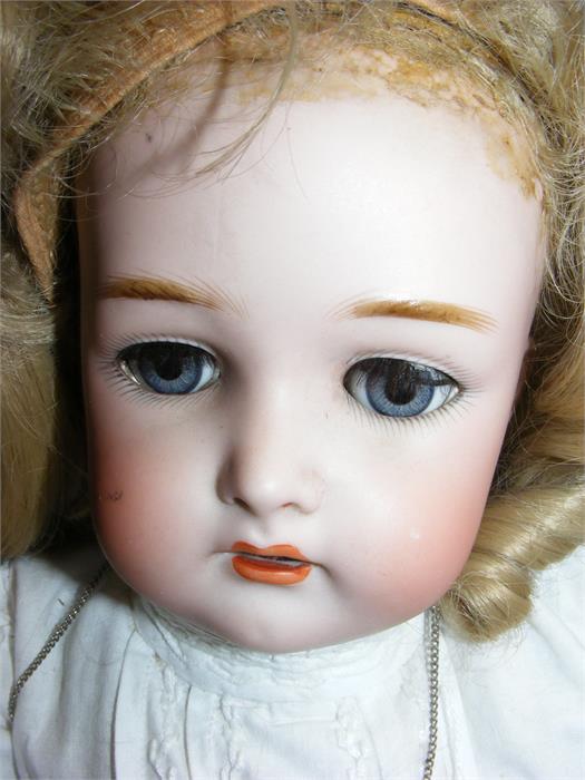 An antique bisque head doll with glass eyes and co - Image 2 of 3