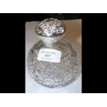 A large silver lidded cut glass scent bottle - 13c