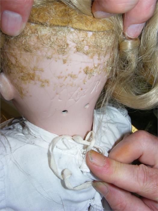 An antique bisque head doll with glass eyes and co - Image 3 of 3