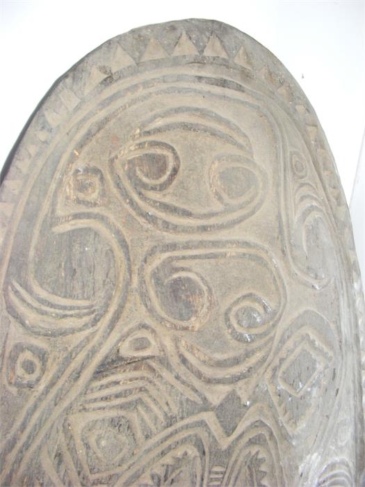 A large carved wooden war shield from the Sepik re - Image 3 of 4