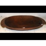 A large carved wooden food bowl from the Trobriand