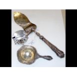 A silver fish server, tea strainer and mustard pot