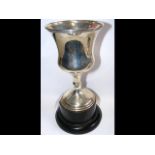 An 18cm high silver presentation cup