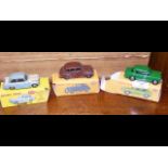 Three reconditioned Dinky Toys with reproduction boxes