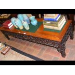 A carved Chinese hardwood low table - 156cm long