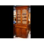 A Victorian mahogany bookcase with glazed upper se