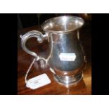 An 11cm high silver tankard