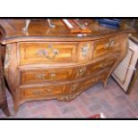 A continental antique bombe shaped commode with gi