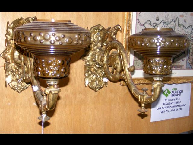 A pair of decorative antique gilt metal wall light