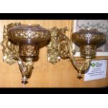 A pair of decorative antique gilt metal wall light