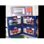 Four boxed Bachmann Goods Wagons, including 37-654