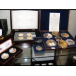 Various collectable coin sets, including "The Hist