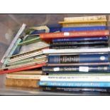 Plastic container of various modern books on the I